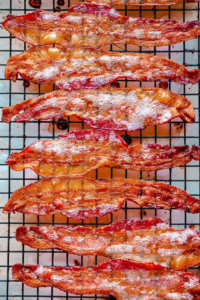 Oven baked bacon on a cooling rack.