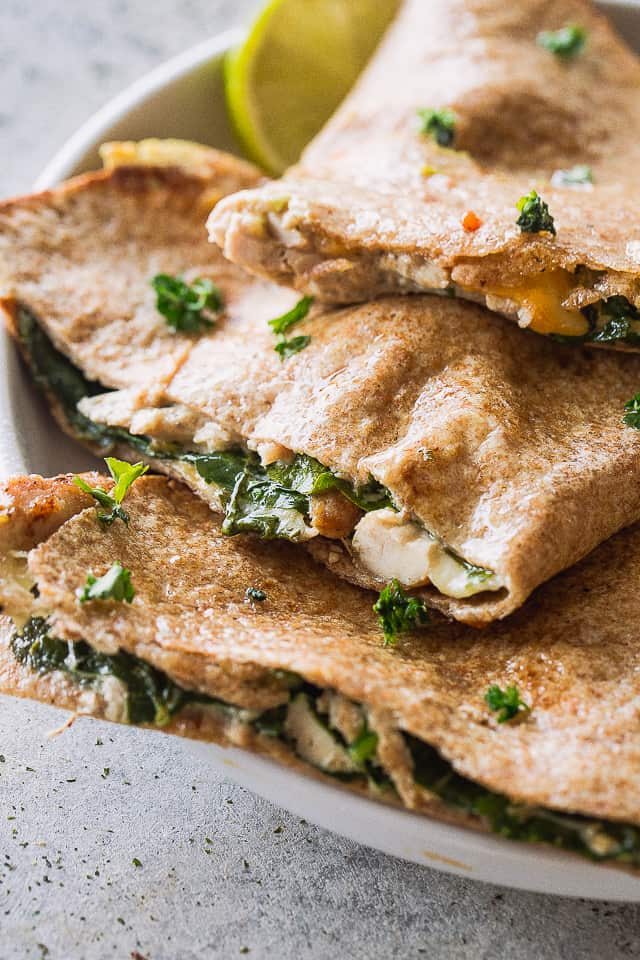 Close up of baked chicken and cheese quesadillas.