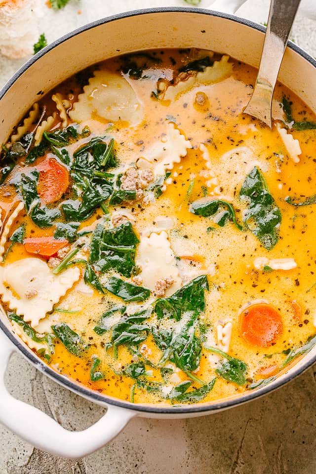 Overhead photo of ravioli soup in a pot.