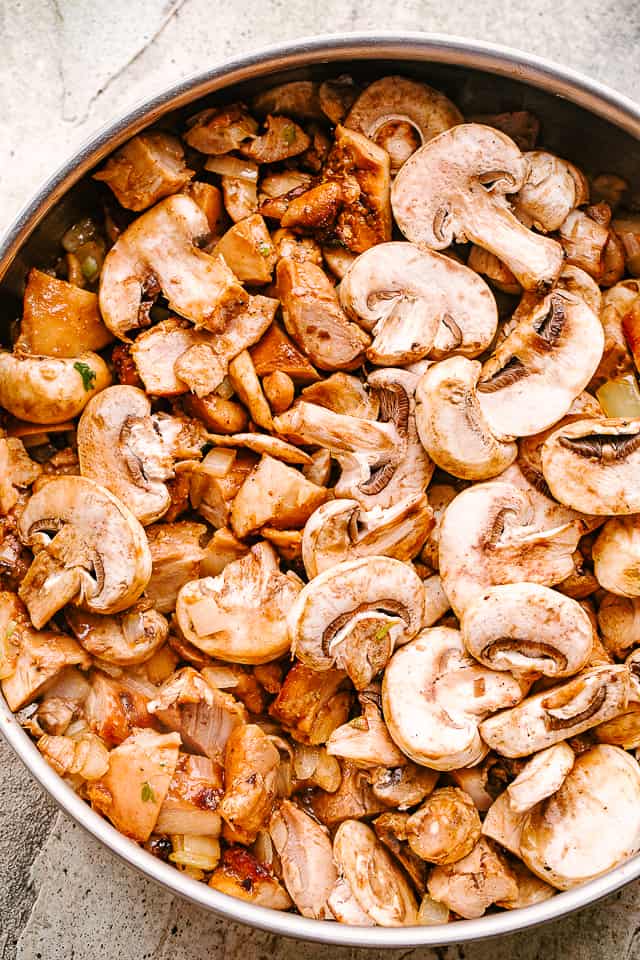 Mushrooms sauteing in a pan