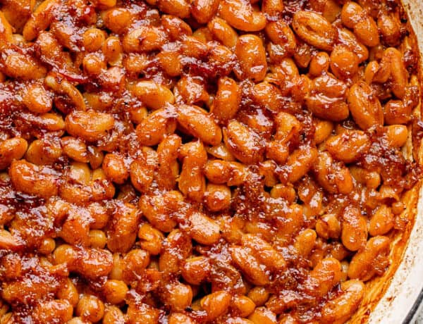 pot of baked beans topped with bacon