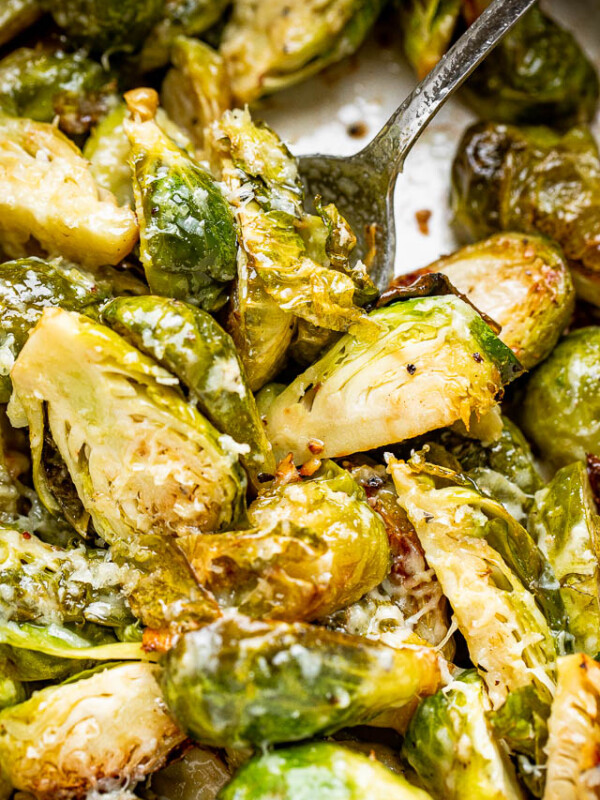 scooping out brussel sprouts from the slow cooker