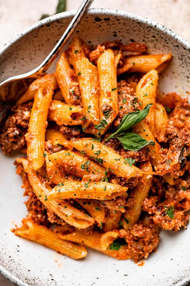 Bowl with ziti pasta and ground beef casserole