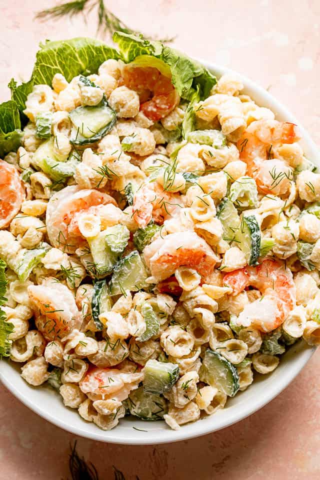 top view of a Creamy Shrimp Pasta Salad in a white salad bowl