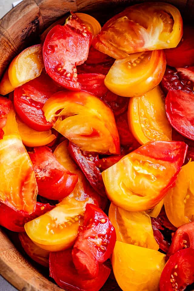 wedges of heirloom tomatoes in a salad bowl