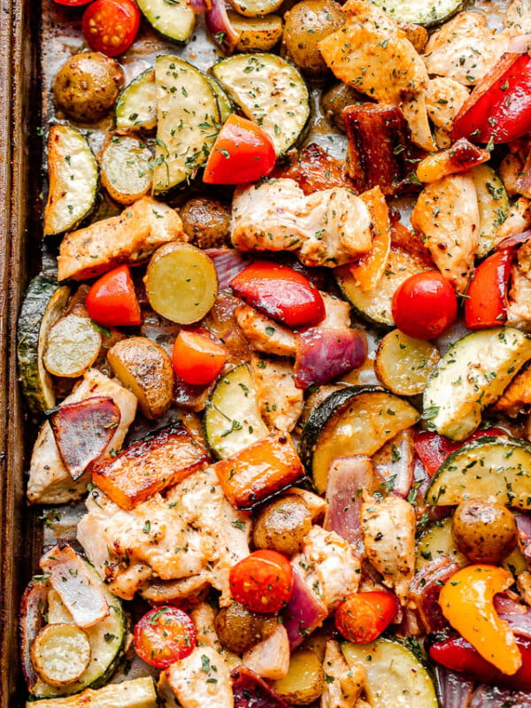 top close up shot of cooked chicken and vegetables on a sheet pan