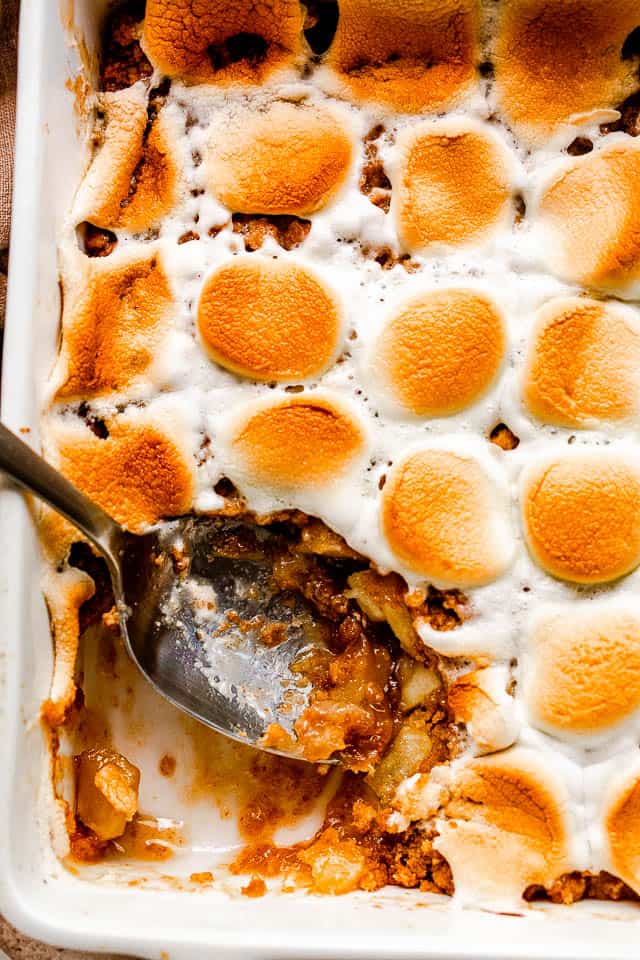 overhead shot of an apple crumble topped with toasted marshmallows