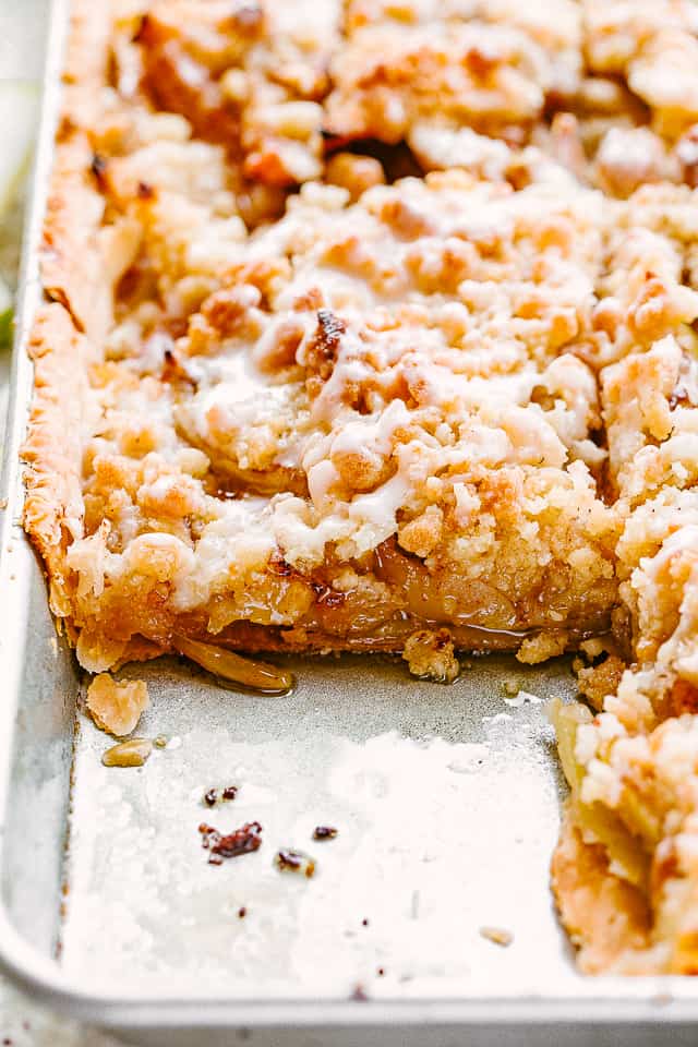 side shot of apple slab pie in a sheet pan.