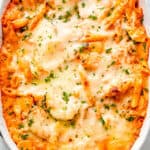 overhead shot of a cheesy baked pasta and zucchini casserole