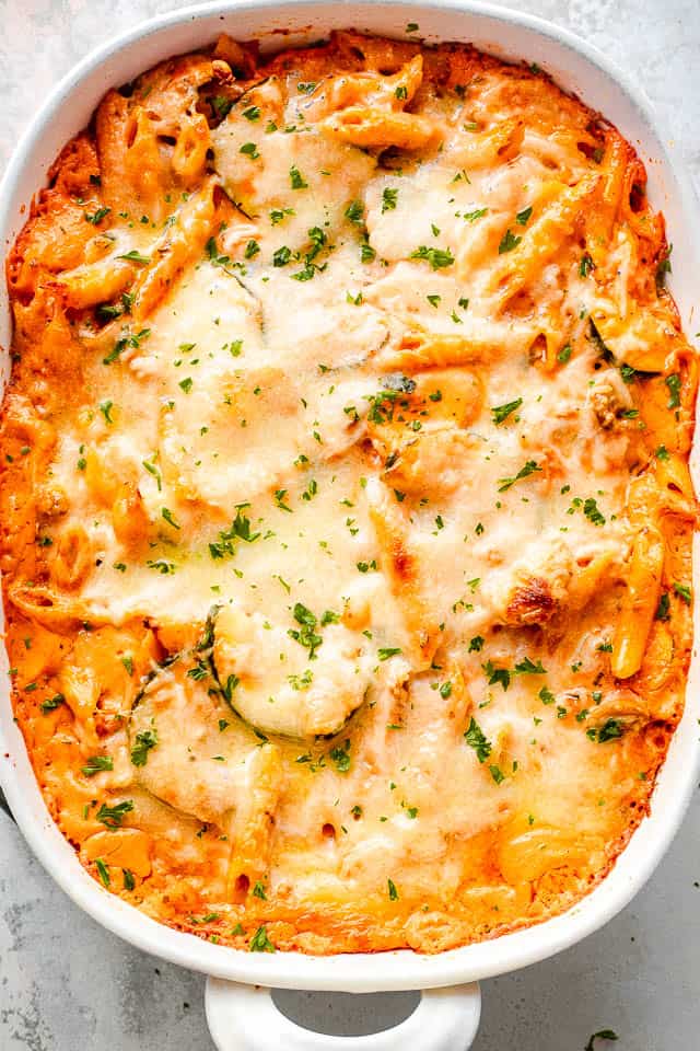 overhead shot of a cheesy baked pasta and zucchini casserole