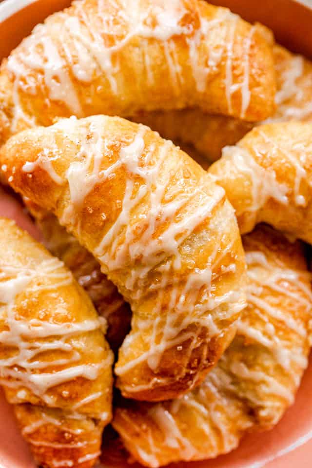 prepared pumpkin crescent rolls in an orange bowl