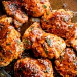 overhead shot of apple cider glazed chicken thighs inside a skillet