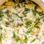 creamy gnocchi soup with spinach and chicken pictured in dutch oven
