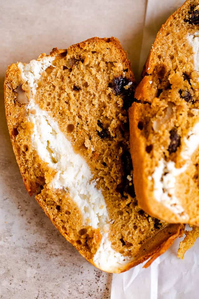 overhead shot of a slice of pumpkin bread stuffed with cream cheese