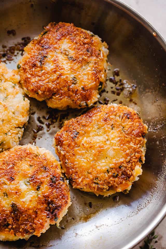 cooking shrimp cakes in a skillet