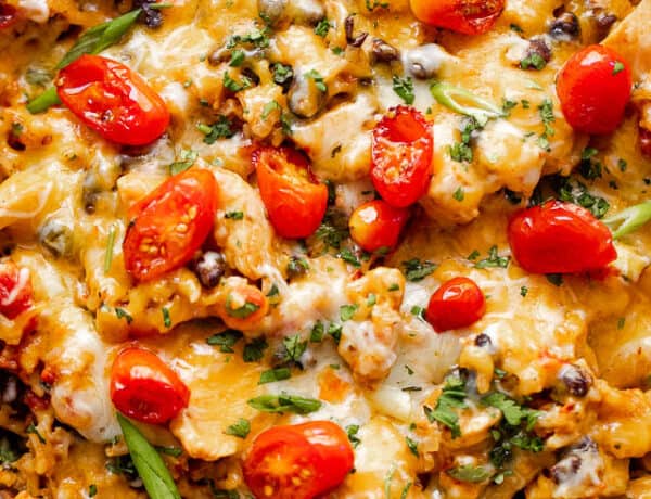 overhead shot of chicken and rice burrito skillet topped with grape tomatoes