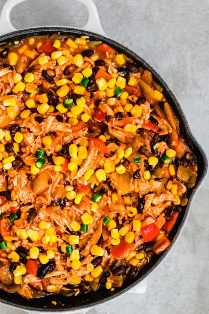 A Chicken Casserole with Corn and Other Veggies in a Skillet