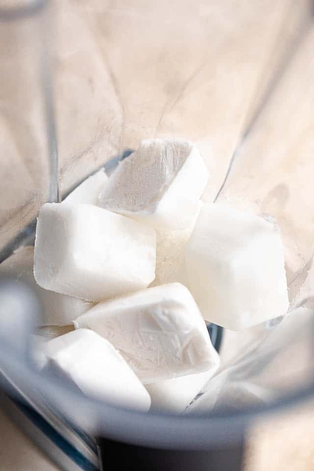 coconut milk ice cubes in a blender