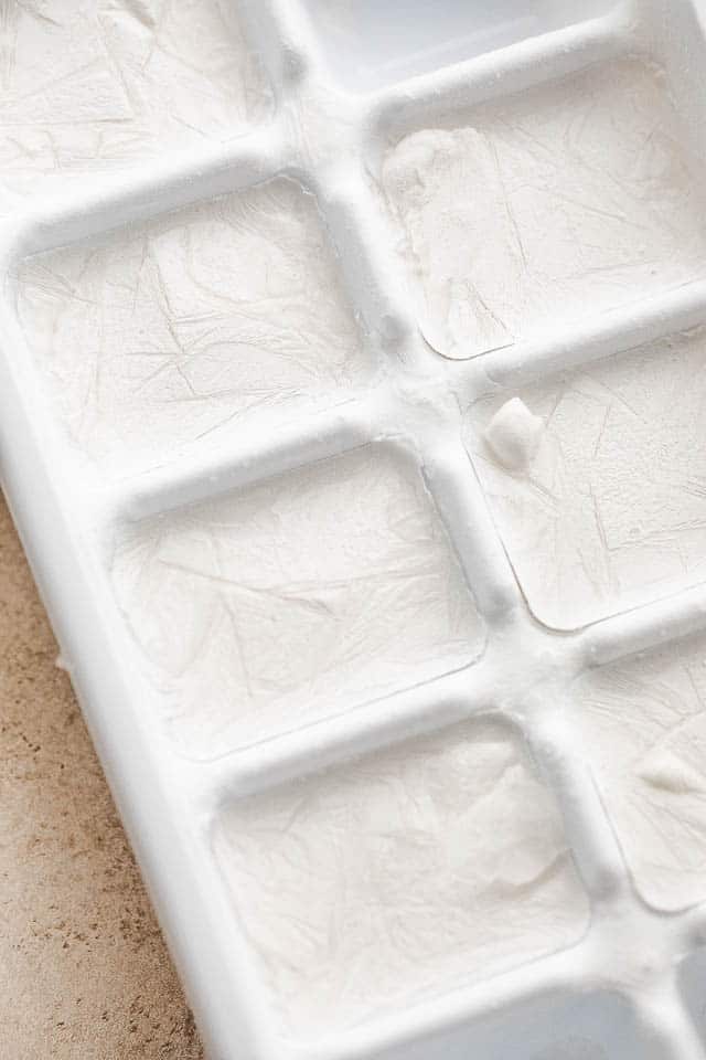 ice cube tray with frozen coconut milk ice cubes