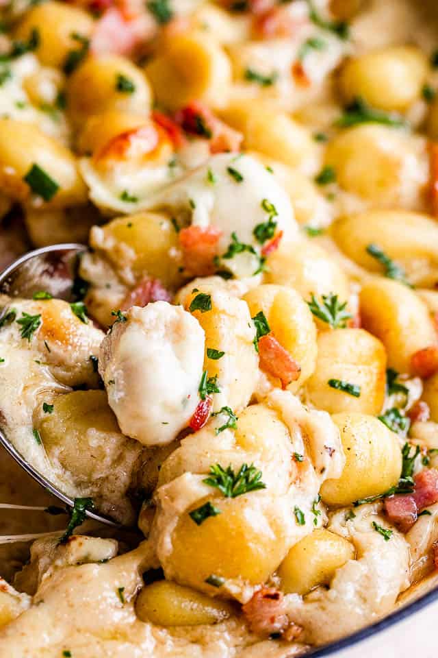 up close shot of a spoon in gnocchi casserole