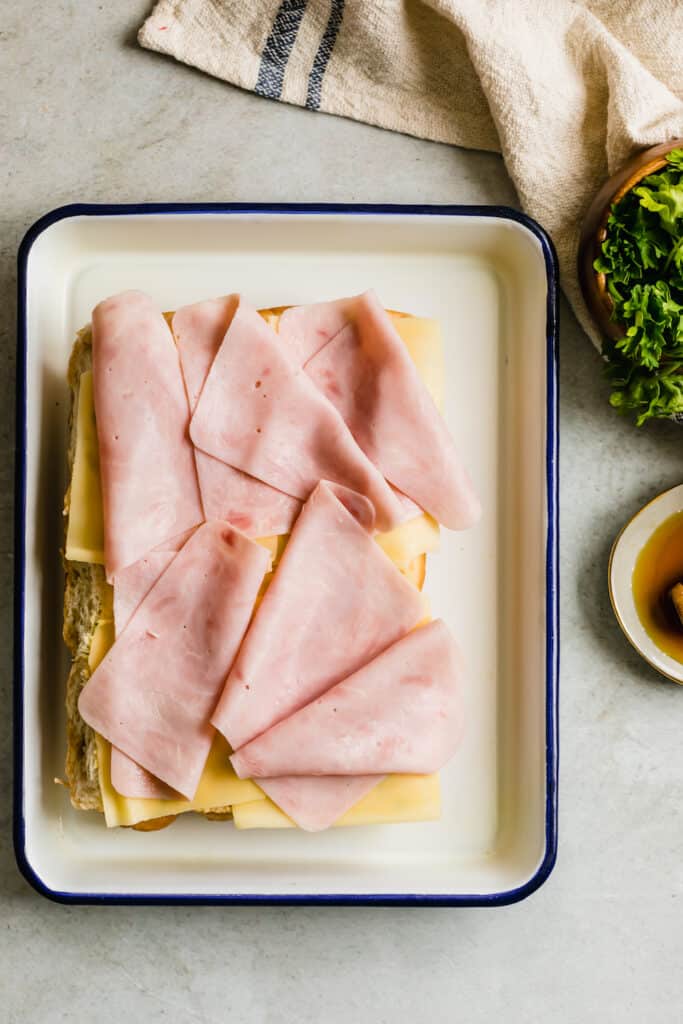 Slices of Ham Layered Over Honey-Dijon Covered Hawaiian Rolls