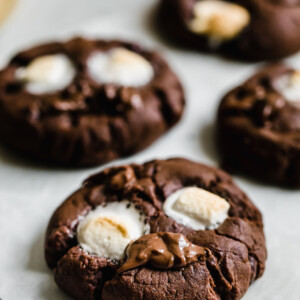 Four Chocolate Marshmallow Cookies on a Sheet of Parchment