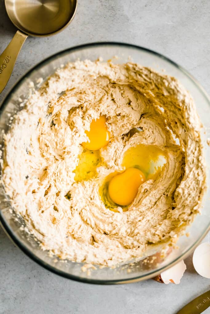 Cookie Batter and Eggs in a Glass Mixing Bowl