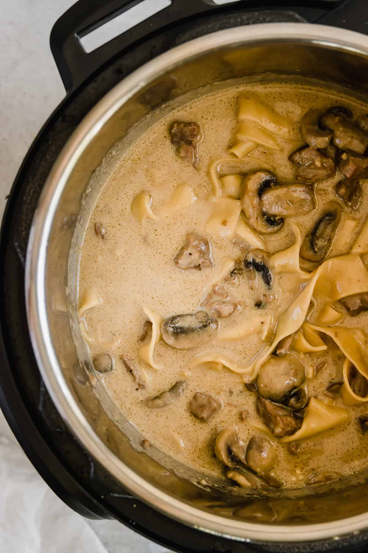 A Pressure Cooker Filled with Beef and Mushroom Stroganoff