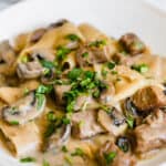 Beef Stroganoff on a White Plate with a Napkin in the Background