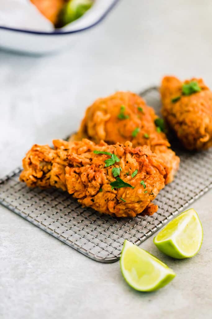 Three Pieces of Buttermilk Fried Chicken Garnished with Chopped Parsley