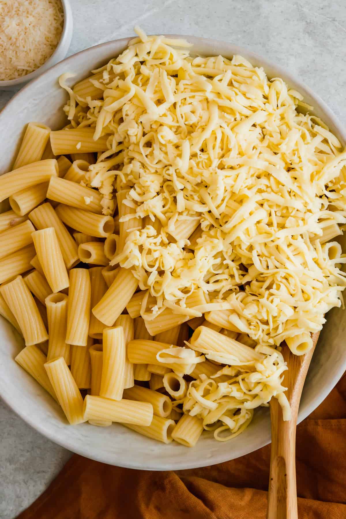 Rigatoni Noodles in a Bowl with Shredded Mozzarella Cheese
