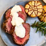 Three Slices of Juicy Beef Tenderloin Topped with Homemade Horseradish Sauce