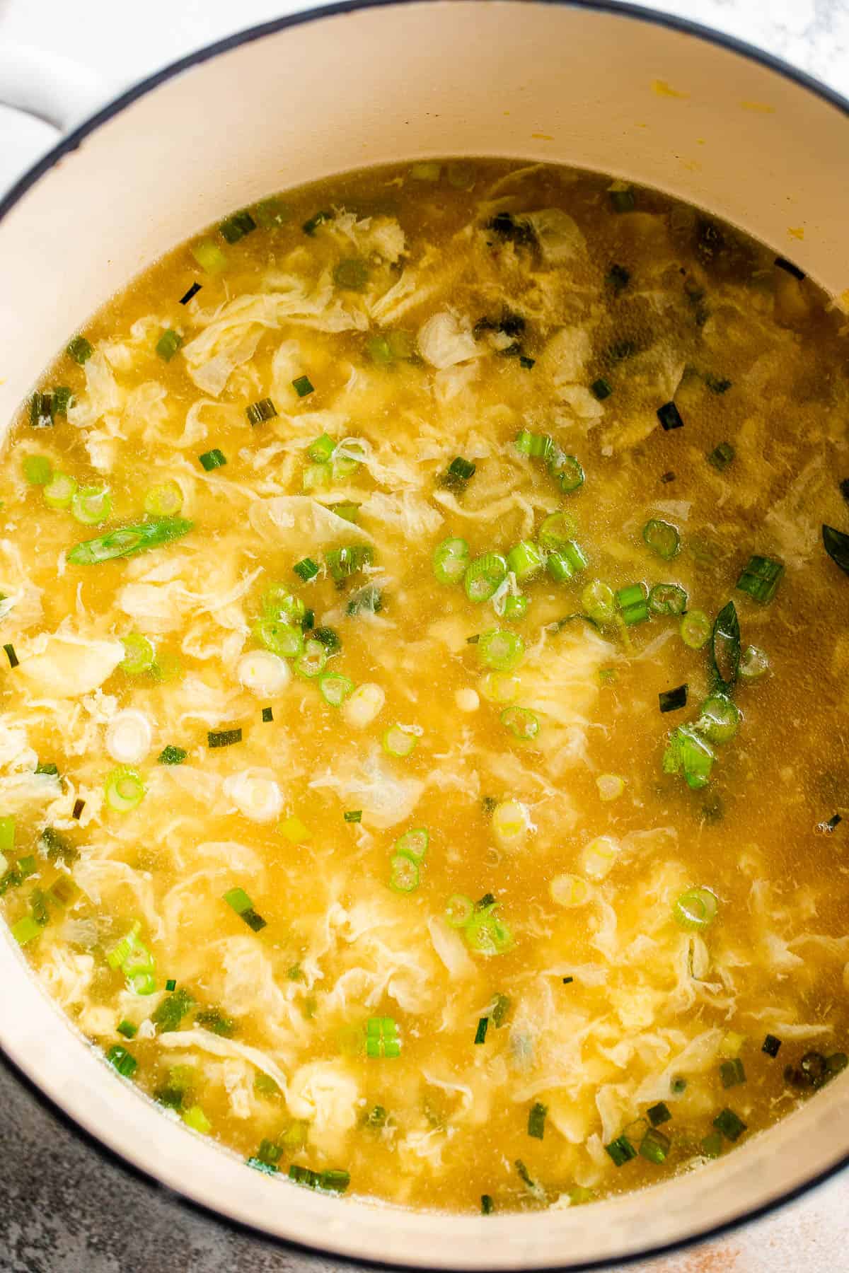 cooking egg drop soup in a dutch oven