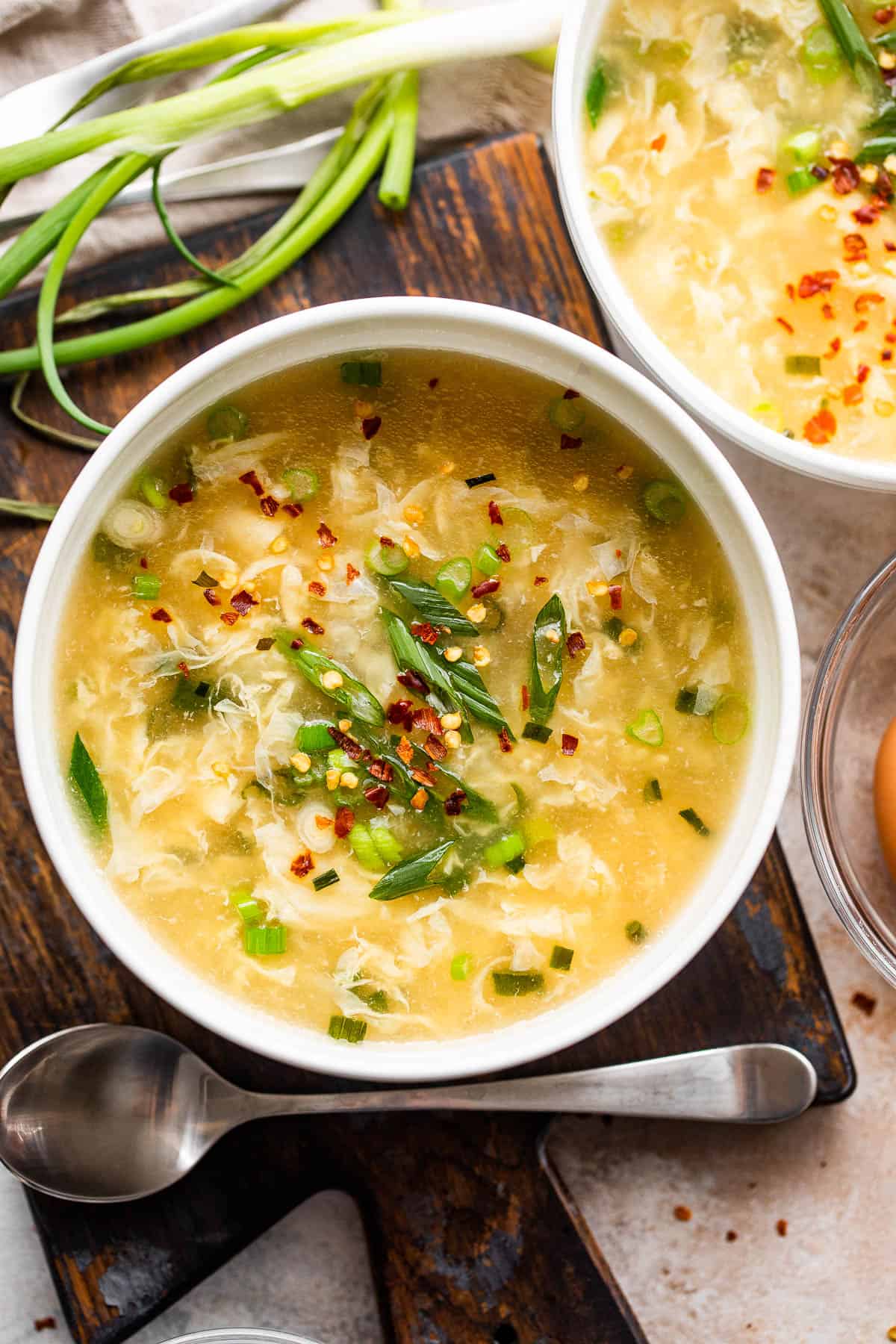 egg drop soup served in two white bowls