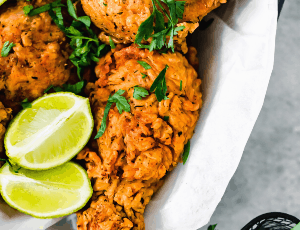 A Basked of Buttermilk Fried Chicken with Lime Wedges Inside