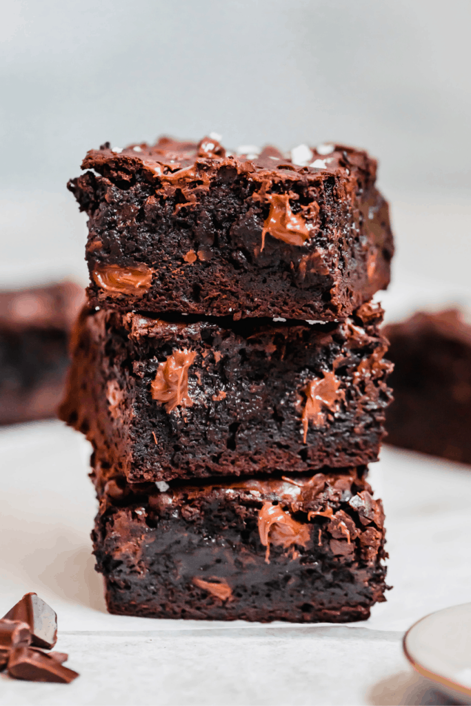 Three Milk and Dark Chocolate Brownies Stacked on Top of Each Other
