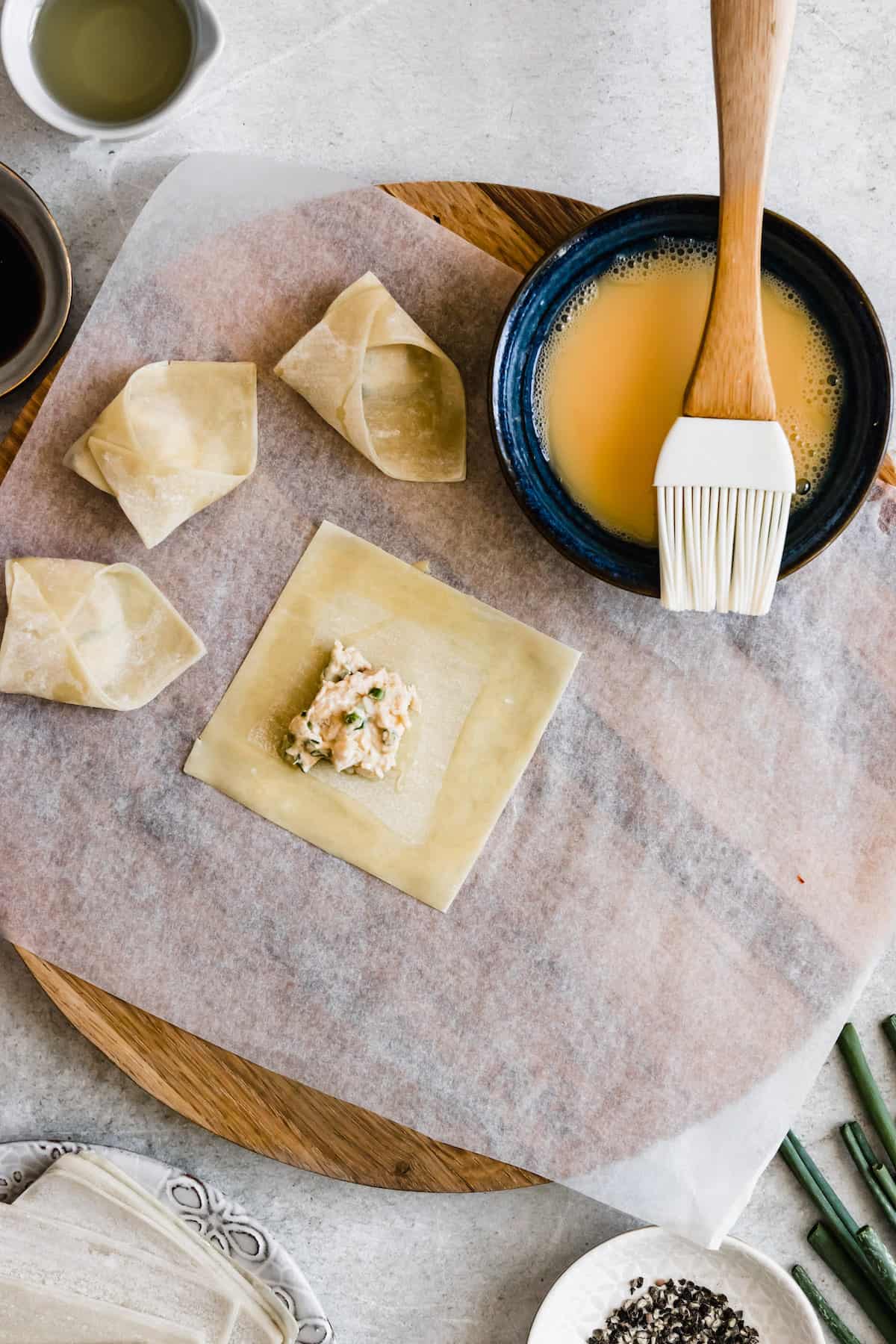 A wonton wrapper with crab rangoon filling.