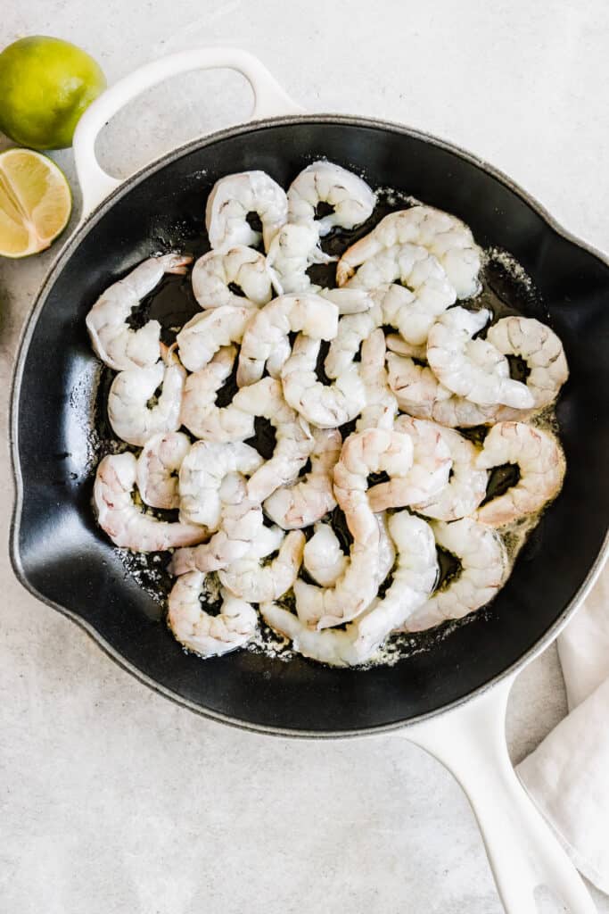 A Skillet on a Counter Containing Raw Shrimp