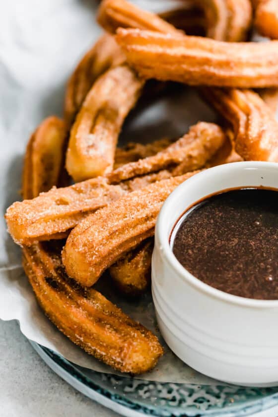 A Close-Up Image of Homemade Churros with Chocolate Sauce on the Side