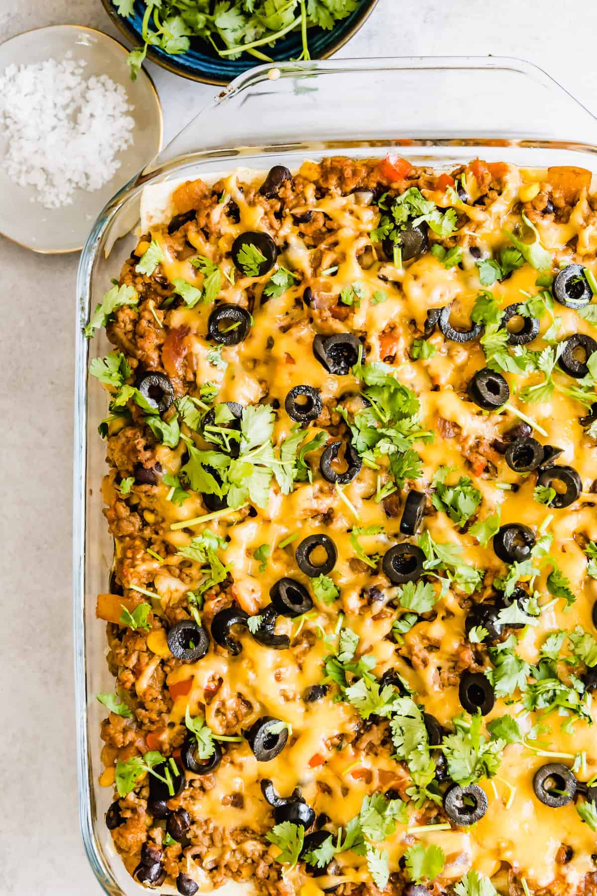 A Mexican Lasagna Casserole in a Clear Baking Dish