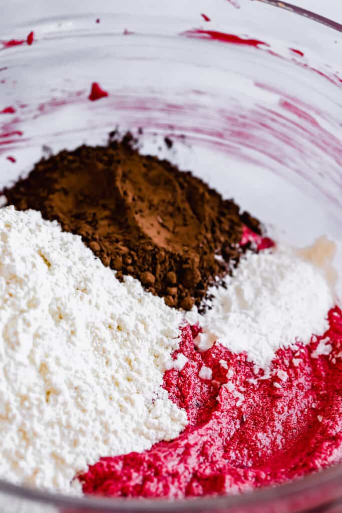 The Dry Ingredients in a Bowl with the Combined Wet Ingredients for Red Velvet Crinkle Cookies