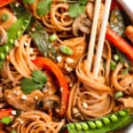 Chicken Lo Mein in a Bowl with a Pair of Wooden Chopsticks