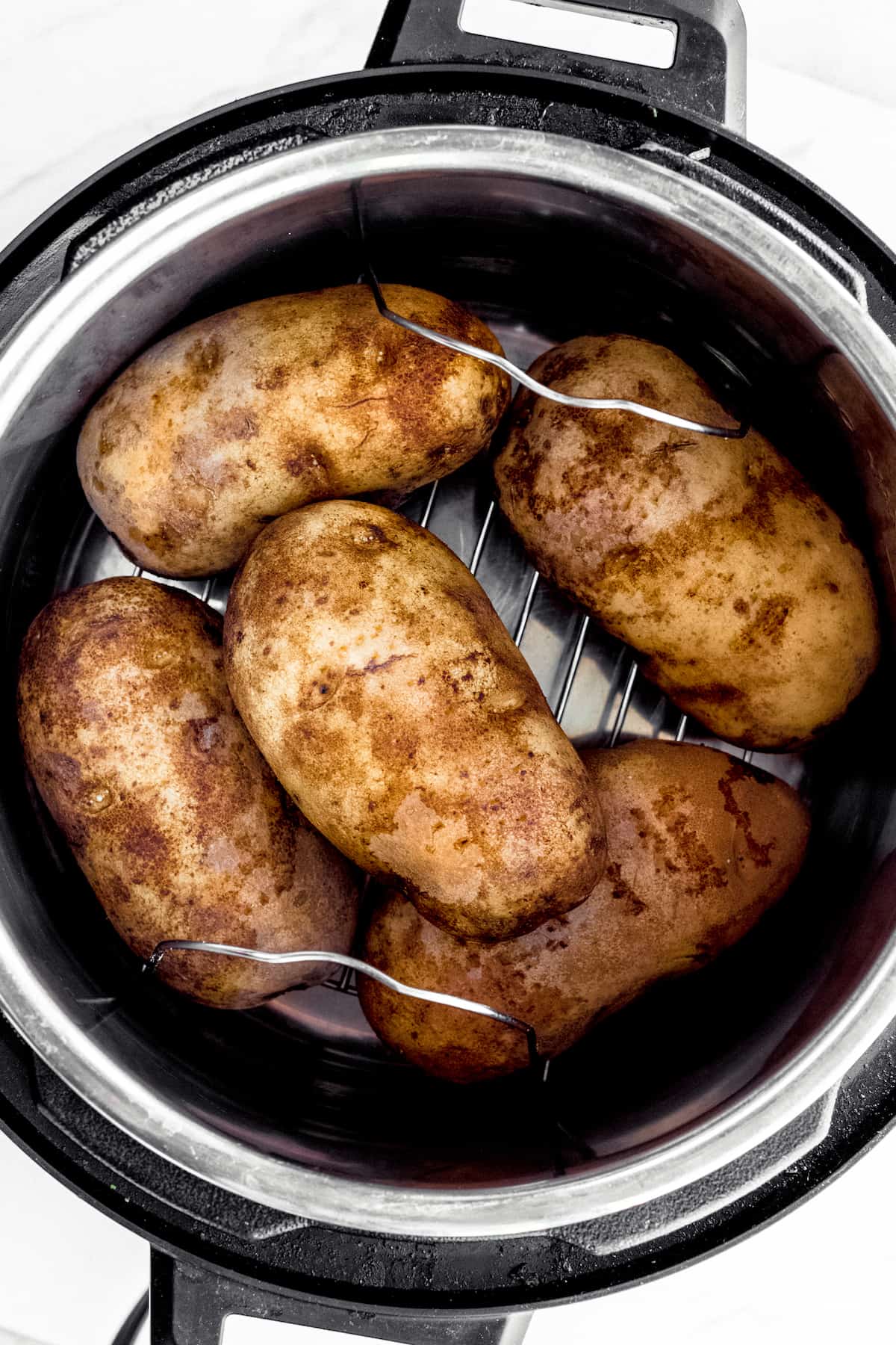 Five Large Russet Potatoes Inside of an Instant Pot
