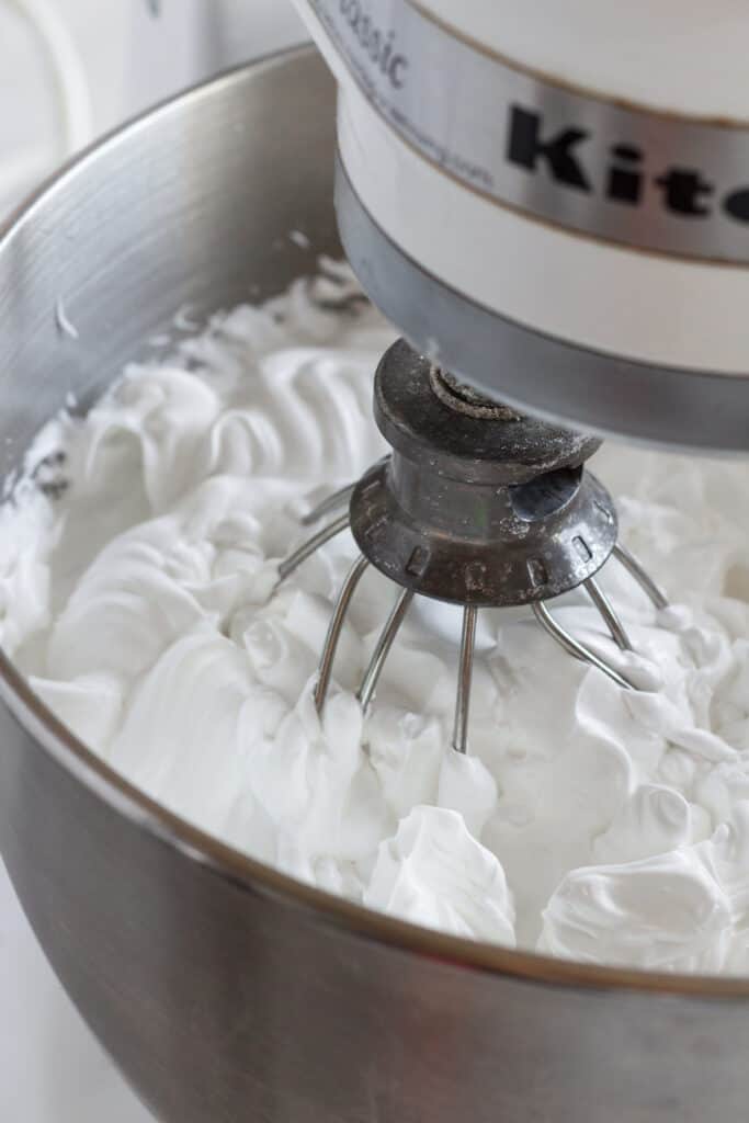 A stand mixer whipping up pavlova