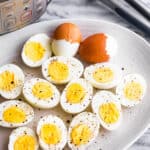 instant pot pressure cooked and a plate of hard boiled halved eggs