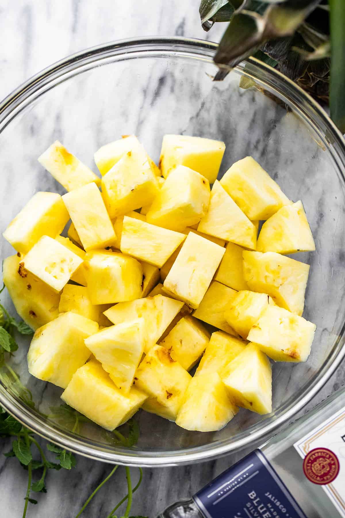 diced fresh pineapple in a glass bowl