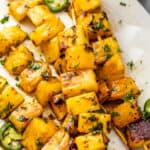 grilled tequila pineapple skewers served on a plate