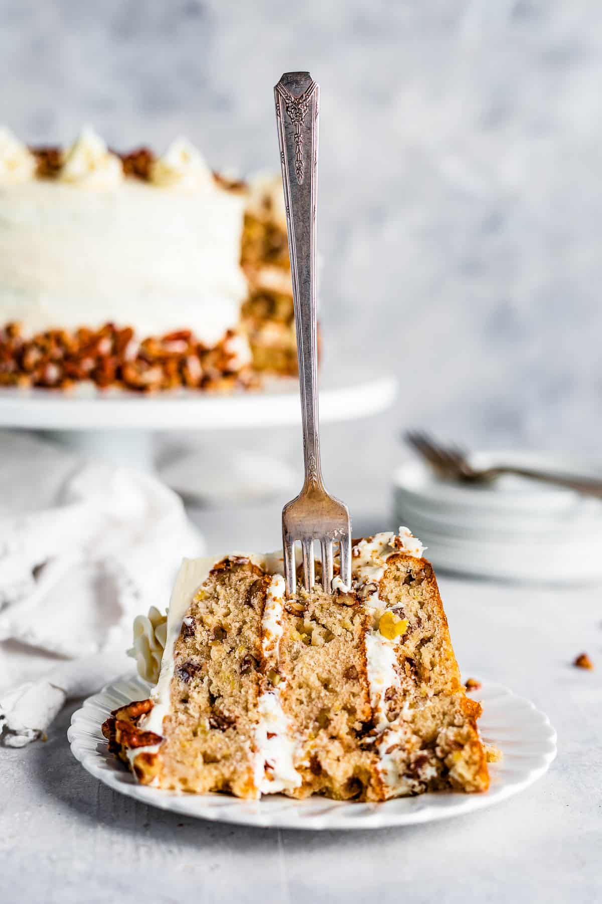 A Piece of Hummingbird Cake with a Metal Fork Stuck Into it