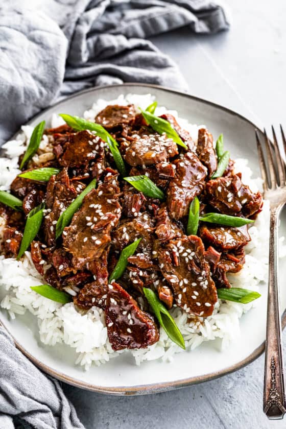 A Plate of Instant Pot Mongolian Beef with Green Onions over Rice