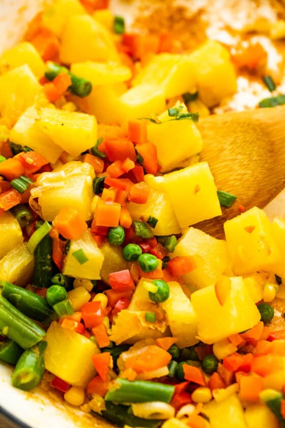 cooking pineapple chunks with veggies